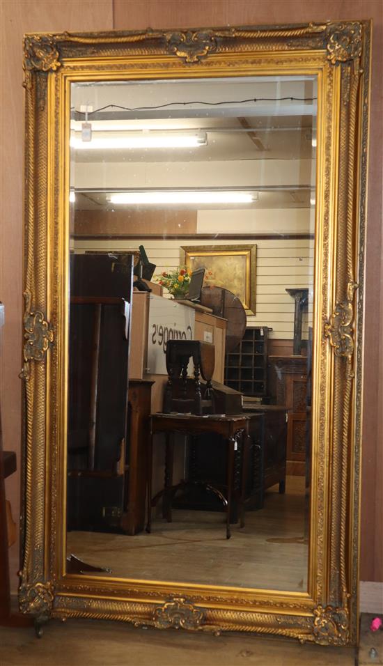 A large gilt-framed mirror H.218cm